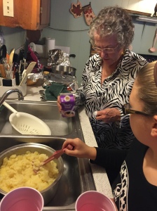 Alli was in charge of mashing to potatoes, while Memo added the ingredients to make them yummy!